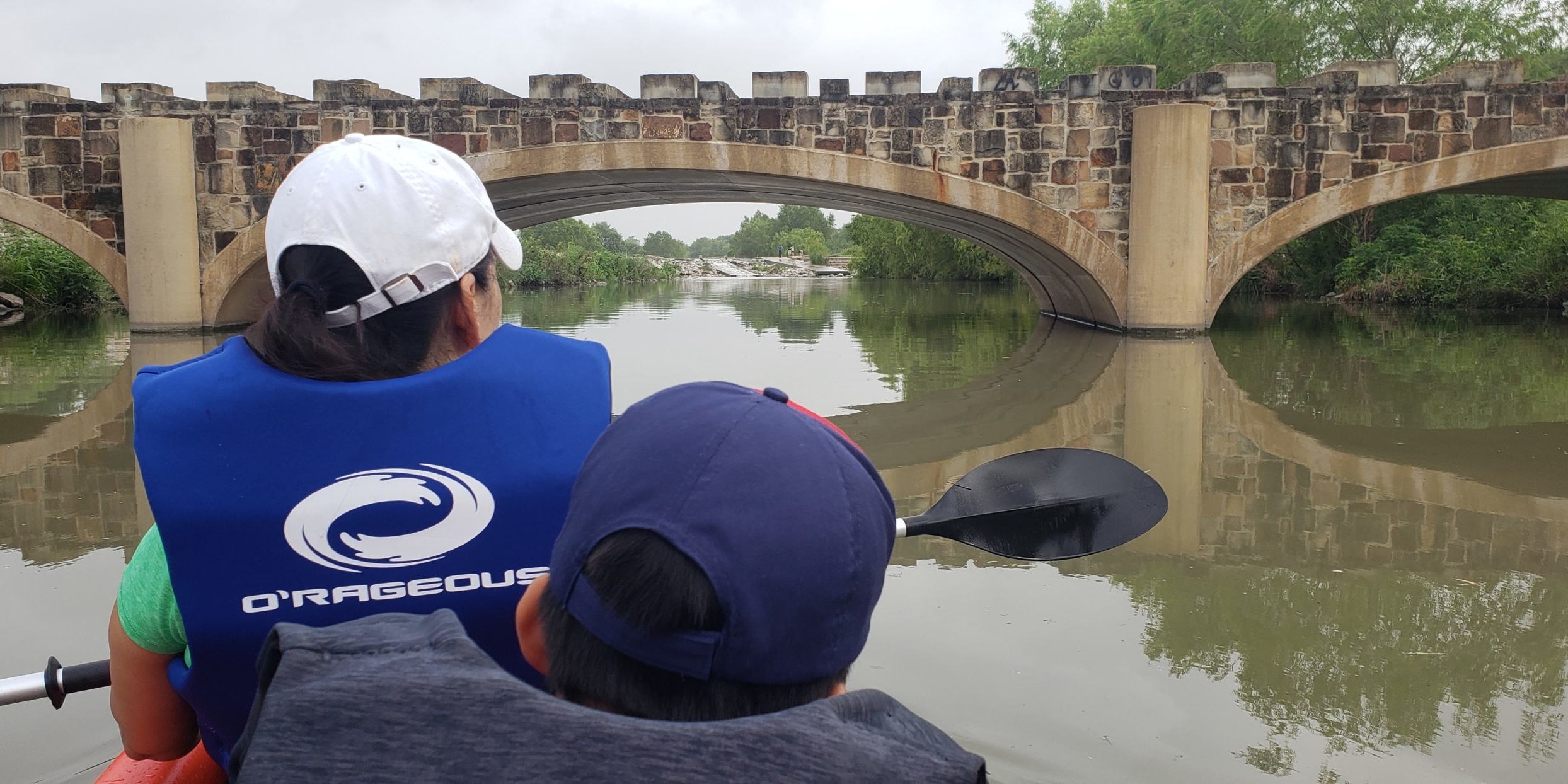 mother and son kayaking on San Antonio River.