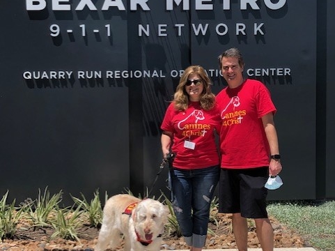 Physician liasion Debbie Rose, her husband and Jazz stand outside Bexar Metro 9-1-1 Network.