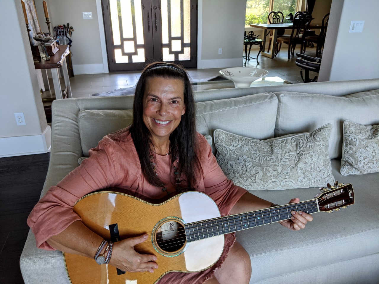 former patient Catherine Gac plays guitar.