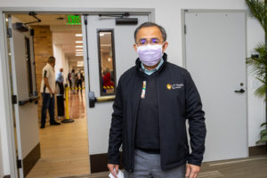 Sal McKeel, a registered nurse and manager of clinical workflow at UT Health Physicians, leaves the Hurd Auditorium after receiving the vaccine.